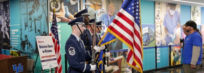 Representatives from the U.S. Military take part in a ceremony honoring veterans inside Squire Hall. 