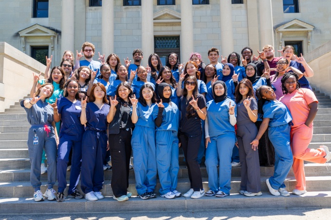 Destination Dental School Fellows and Dental Student Volunteers on the steps of Abbott Library in June 2026. 