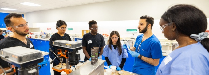 Student in the pre-clinic assisting fellows. 