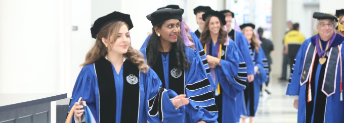 Photo of graduates at commencement. 