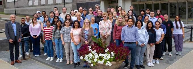 Members of the Department of Oral Biology pose for a group photo outside of the Biomedical Research Building. 