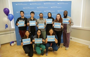 Dental students holding up Match Day signs for Match Day 2025. 