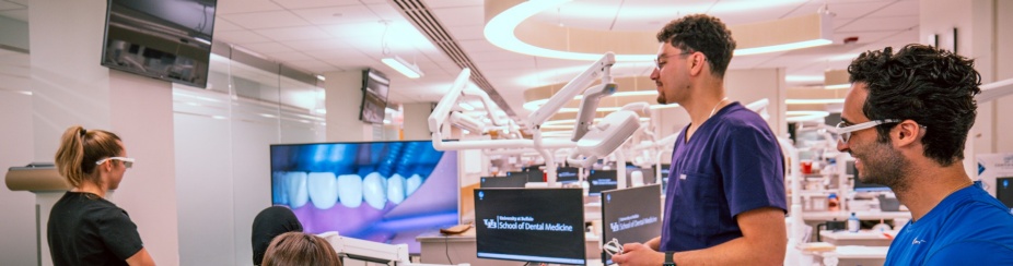 Group of UB SDM students working in pre-clinic facility.