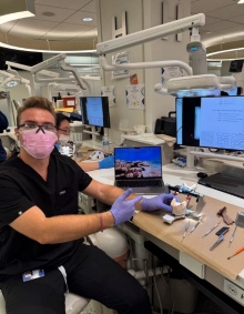 dental student working on benchtop in preclinic simulation lab. 