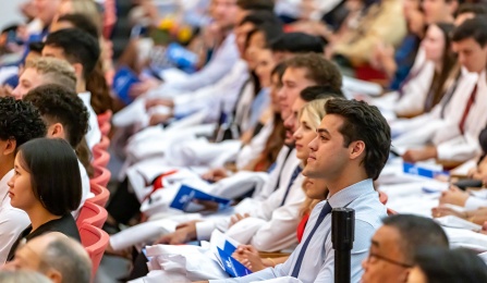 group of seated students at the White Coat ceremony.