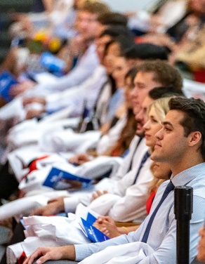 group of seated students at the White Coat ceremony. 
