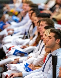 group of seated students at the White Coat ceremony. 