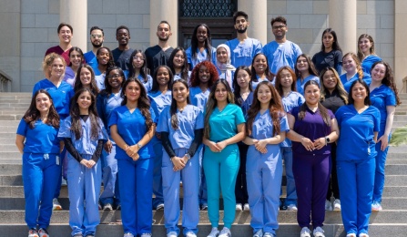 Destination Dental School students pose on the steps of Abbott Library for a group photo. 