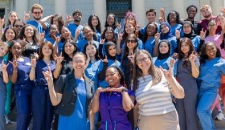Destination Dental School students pose on the steps of Abbott Library for a group photo. 