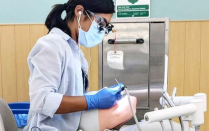 UB SDM Student working on a typodont in the preclinic simulation laboatory. 