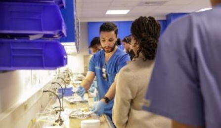 dental student working on a benchtop in the preclinic simulation lab. 