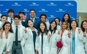 A picture of our Dean with several new incoming students atour White Coat Event. 