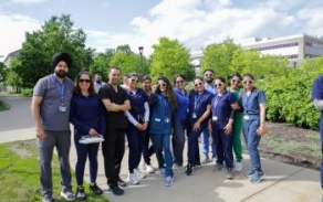 dental students standing in front of trees with sunglasses on. 
