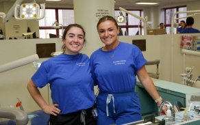 current dental students posing for a picture. 