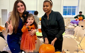 students and families at Halloween event. 