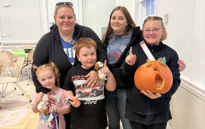 students and families at Halloween event. 