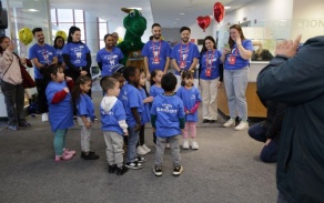 dental students in blue shirts helping children at Give Kids a Smile Day 2025. 