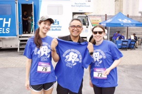 3 students posing for a picture at the chasing healthy smiles 5k. 