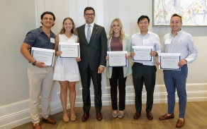 students pose with the dean and their award certificates for the Scholarships and Awards Ceremony 2023. 