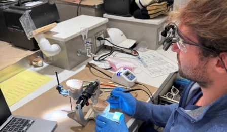 student working on benchtop in the preclinic simulation lab.