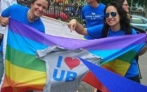 UB students holding a pride flag. 