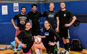 UB SDM students posing after a volleyball game. 