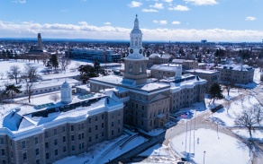 Picture of south campus from an aerial view showing one academic building with surrounding landscape during winter. 