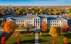Picture of south campus from an aerial view showing one academic building with surrounding landscape during fall. 