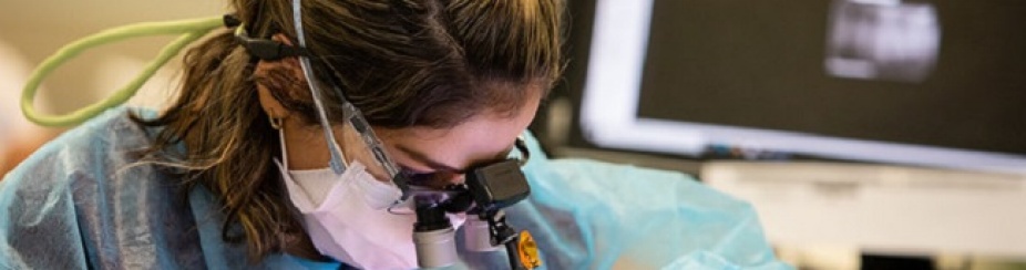 Photo of dental student working on a patient in the lab. 