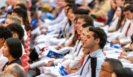 group of seated students at the White Coat ceremony. 