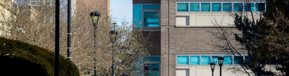 Snow on South Campus in January 2026. People walk near Abbott Library.