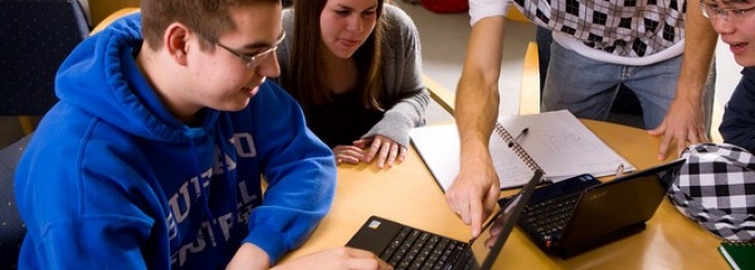 "students working on computers". 