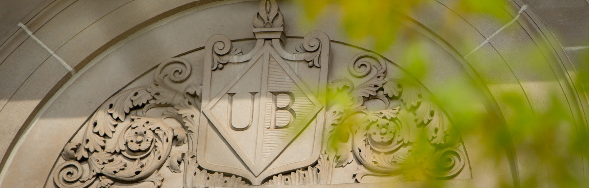 UB engraving on a stone building exterior. 
