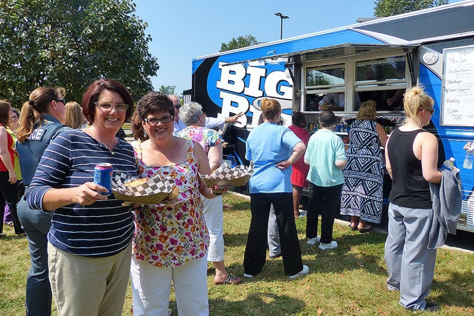 UB staffers check out Big Blue, UB's new food truck, during a dry run at Crofts Hall. 