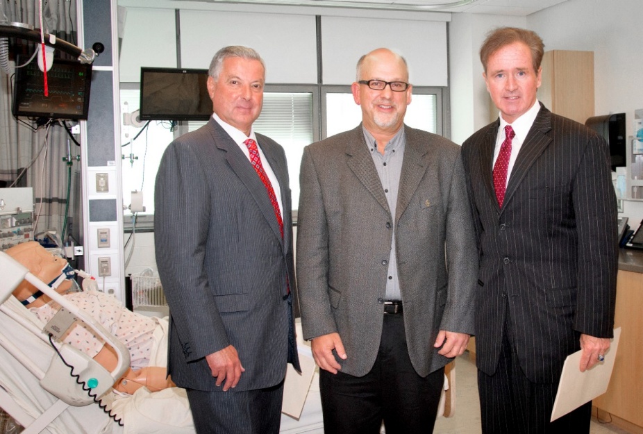 Michael Cain, Steve Koury and Brian Higgins pictured in UB's Behling Simulation Center. 