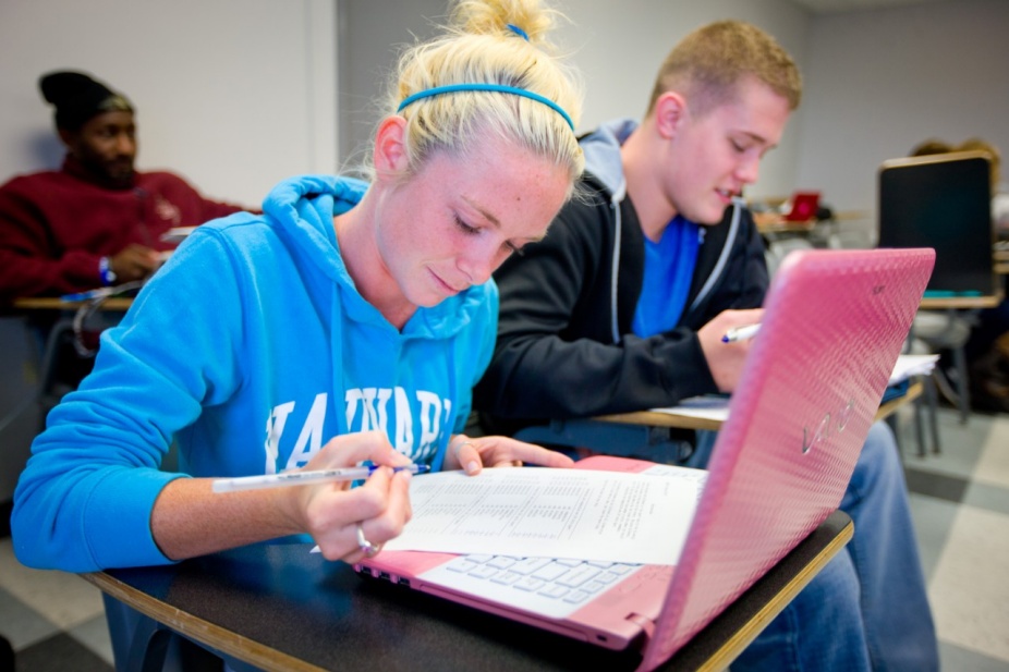 Student filling out a form. 