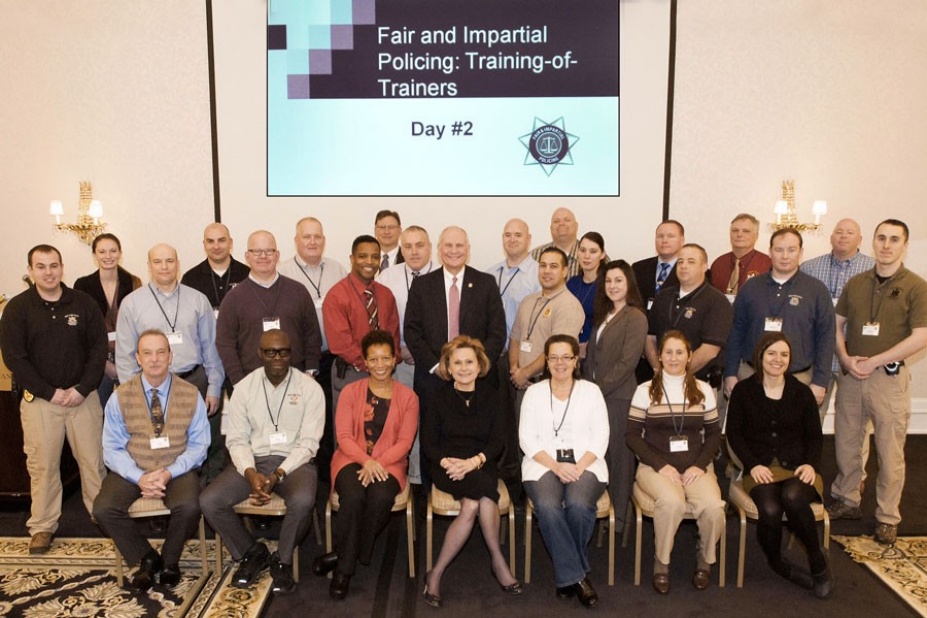 Zoom image: UB's Chris Bartolomei (middle row, second from left in blue shirt) is pictured with other SUNY police offers who attended the training session in Syracuse this week. 