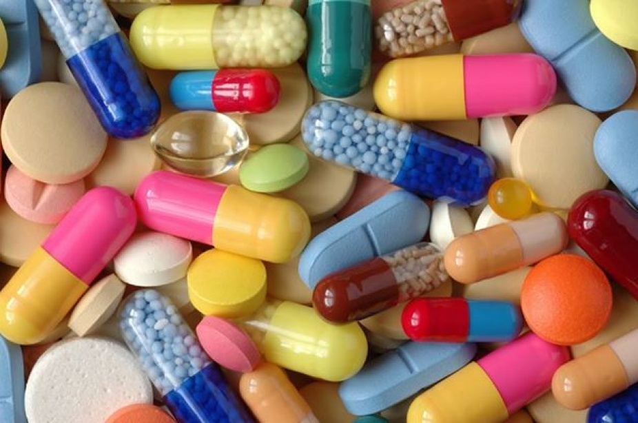 A collection of multicolored capsules and pills.