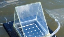 An angular device floating on lake water. 