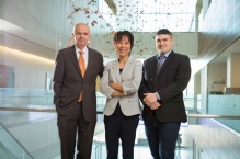 Jeff Harvey, Hui Meng and Vincent Tutino standing in a modern building.