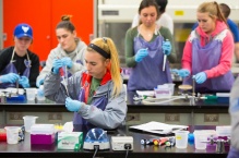 Students using pipettes in the lab.