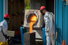 Zoom image: Researchers pour lava from the furnace after the melt is complete. The furnace is located at the University at Buffalo&rsquo;s Geohazards Field Station in Upstate New York. Credit: Douglas Levere / University at Buffalo 