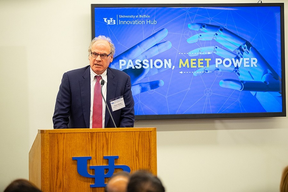 Howard Zemsky speaks from a podium during the Innovation Hub launch announcement.