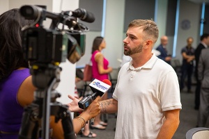 Zoom image: "They were in my corner before I was in my own corner," said Thomas Deponceau, a patient treated by Dr. Lynch in the Emergency Department and who was successfully linked to care through Buffalo MATTERS. He spoke with media at the UB briefing. (Credit: Douglas Levere, University at Buffalo) 