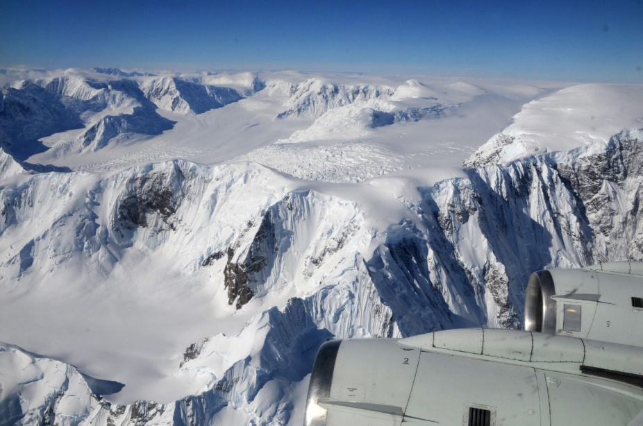 Zoom image: Antartica, as viewed through the window of an airplane. Credit: Tony Schenk. Available for download on Beata Csatho's Flickr page. 