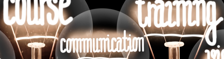 Three lights bulbs. Each has a word lit up inside the bulb. The words say course, communication and training. 