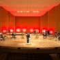 Buffalo Philharmonic Orchestra's brass section on stage with plexiglass partitions. 