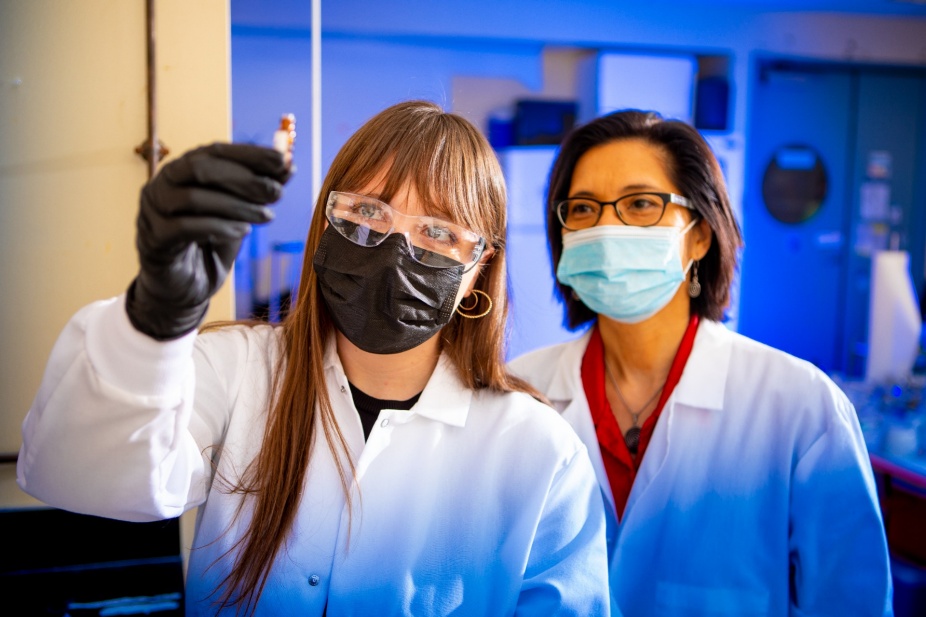 Zoom image: From left: UB chemistry PhD candidate Rebecca Dickman (left)&nbsp;in the lab with&nbsp;UB chemistry professor and UB RENEW Institute Director Diana Aga. Dickman is among scientists in the Aga lab who are conducting research related to improving the analysis of PFAS, especially the identification of emerging PFAS. Credit: Douglas Levere / University at Buffalo 
