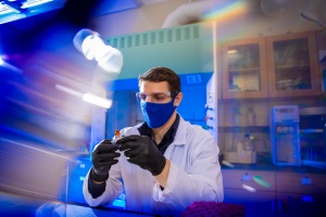 Zoom image: Zacheriah Gernold, UB&nbsp;chemistry&nbsp;PhD student,&nbsp;is part of a team that is leveraging analytical chemistry to study whether persistent chemicals, including PFAS, are present in the eggs of various bird species. He is pictured holding a vial containing freeze-dried material from abandoned double-crested cormorant eggs collected from around Lake Erie.&nbsp;Credit: Douglas Levere / University at Buffalo 