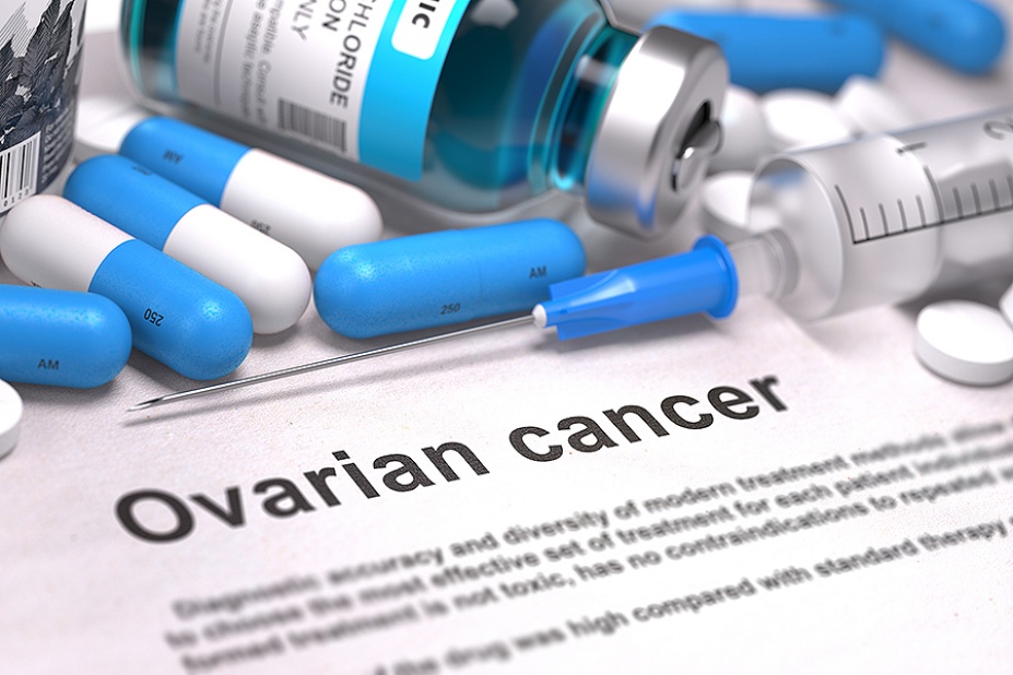 Concept of ovarian cancer treatment featuring capsules, a vile, a syringe and the words, "Ovarian cancer.". 